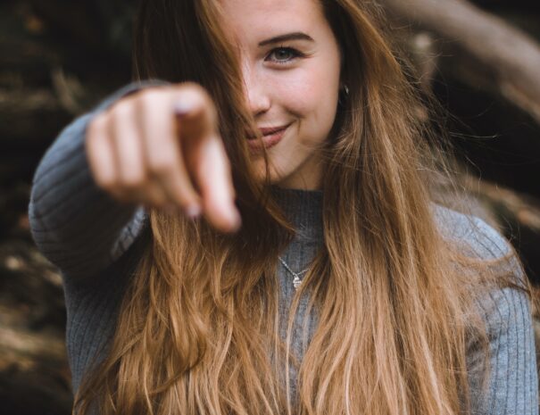 Lady pointing to you, looking for new colleagues